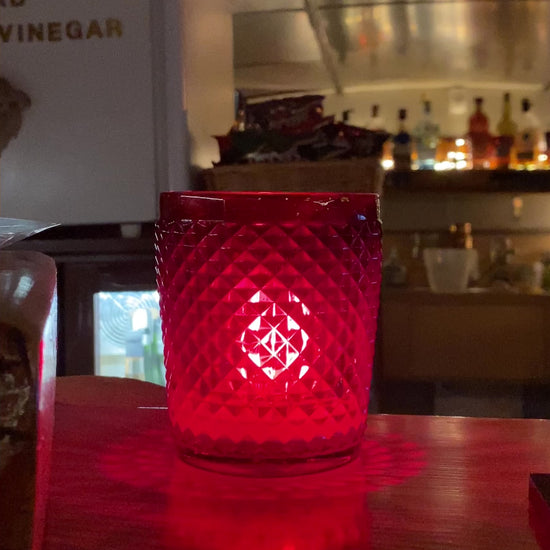 Pure Love soy candle burning in a pub